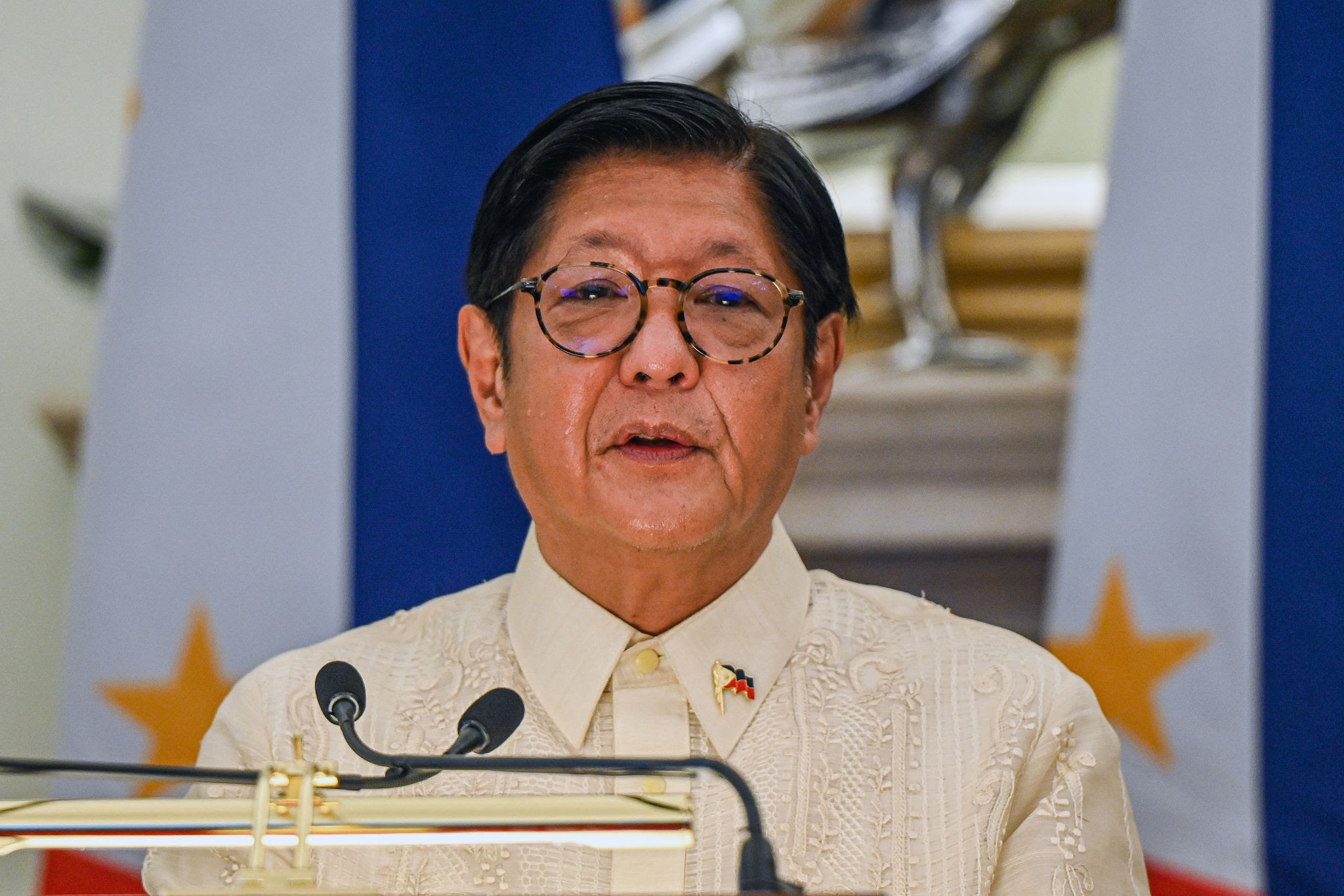 President Ferdinand Marcos Jr. during a formal setting as online commentary reacts to a Palace health update describing him as “overworked.”