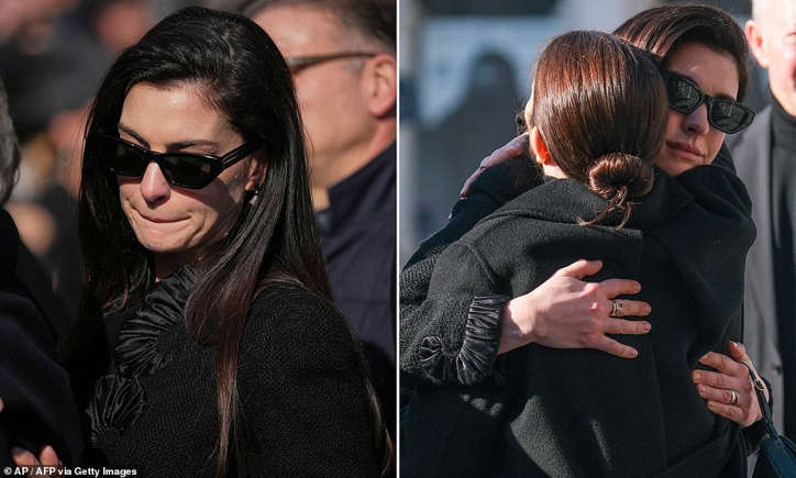Anne Hathaway visibly emotional while attending the funeral of fashion designer Valentino Garavani, honoring his legacy.