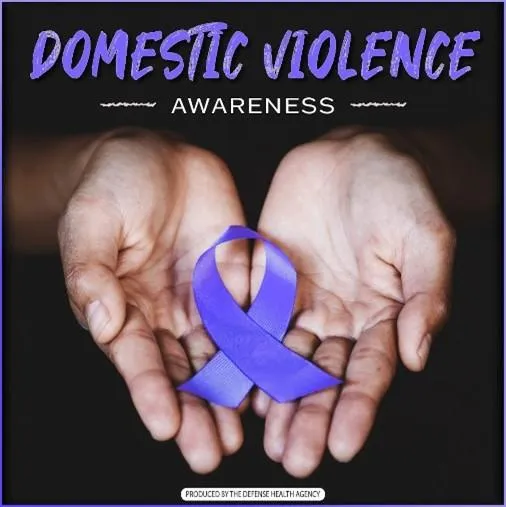 Domestic Violence Awareness Month Ribbon in Hands