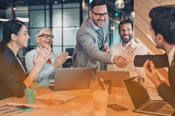 llustration of MSP and MSSP professionals collaborating with vendors to build long-term partnerships, symbolizing brand evolution from vendor to trusted partner.