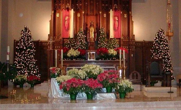 Altar front garland decor draped beautifully with lights, ornaments, and greenery for a perfect Christmas touch.
