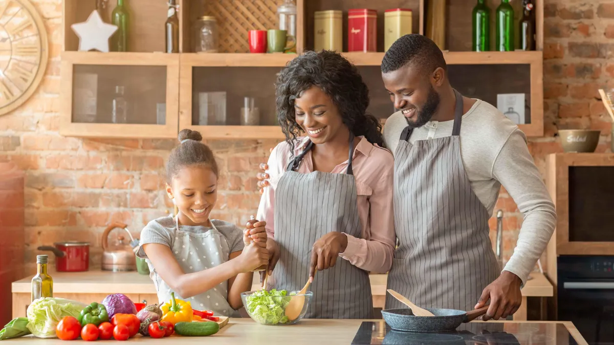 The parents are ensuring that their kid stays healthy and happy.