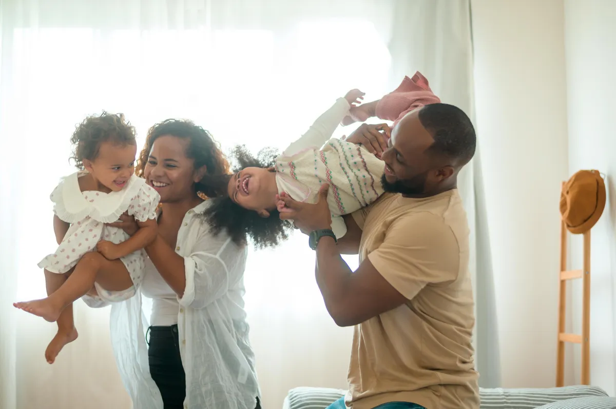 Parents playing with their children