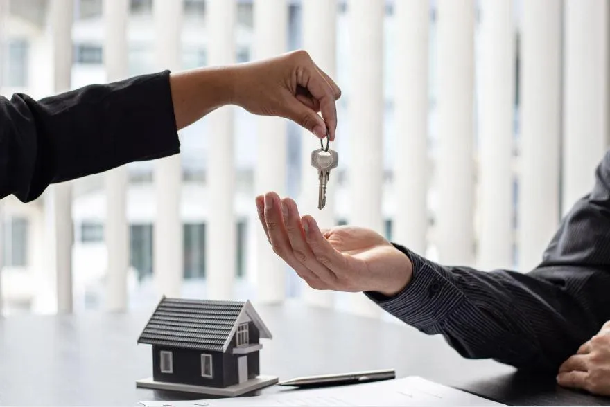 Illustration comparing term life insurance to renting a home and whole life insurance to buying a home, highlighting different financial benefits.