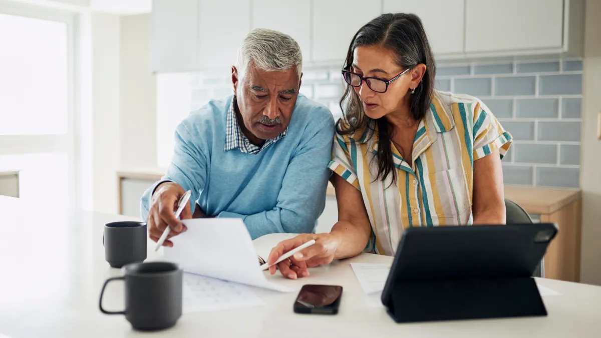 Older couple reviewing Medicare plan options at home