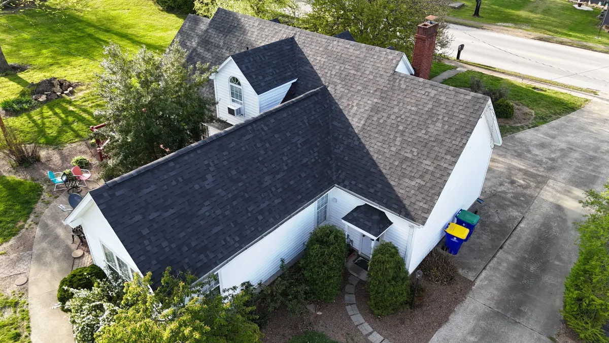 Residential roof showing areas of damage and repair needs
