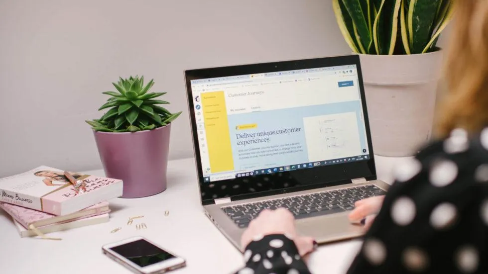 Open laptop with Canva on screen