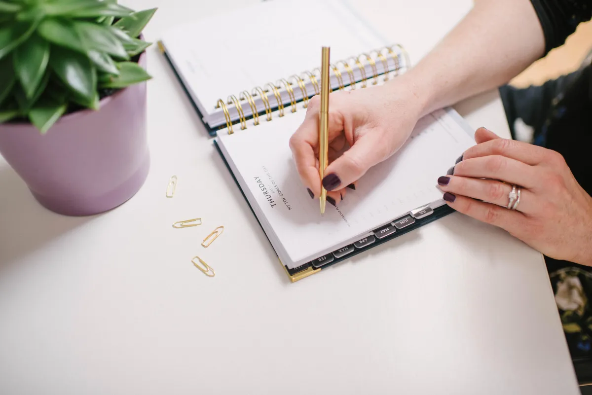 Hand writing in a notebook