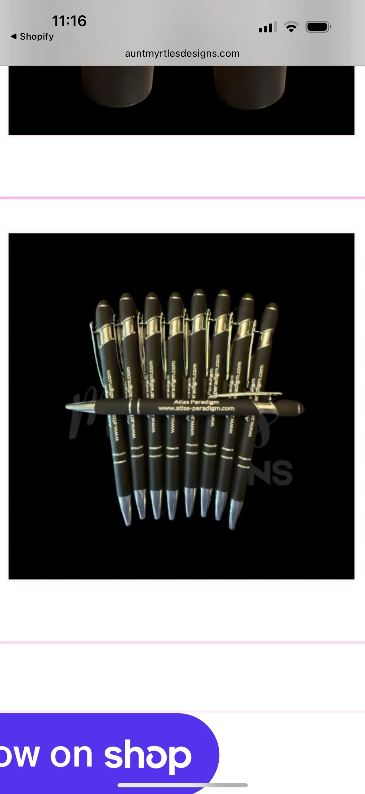 10 black pens with Atlas Paradigm and their website laser engraved on