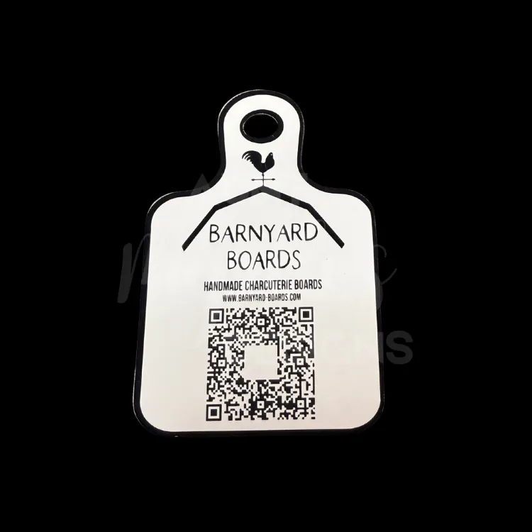 A charcuterie board magnet with Barnyard Boards logo and QR code to their website.