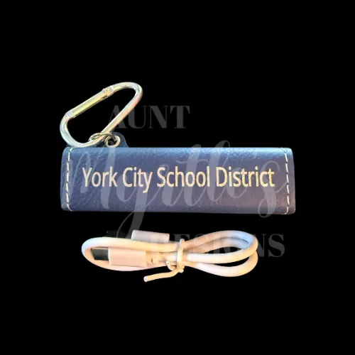 Blue leather powerbank with York City School District laser engraved on