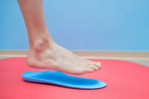 foot trying orthotics