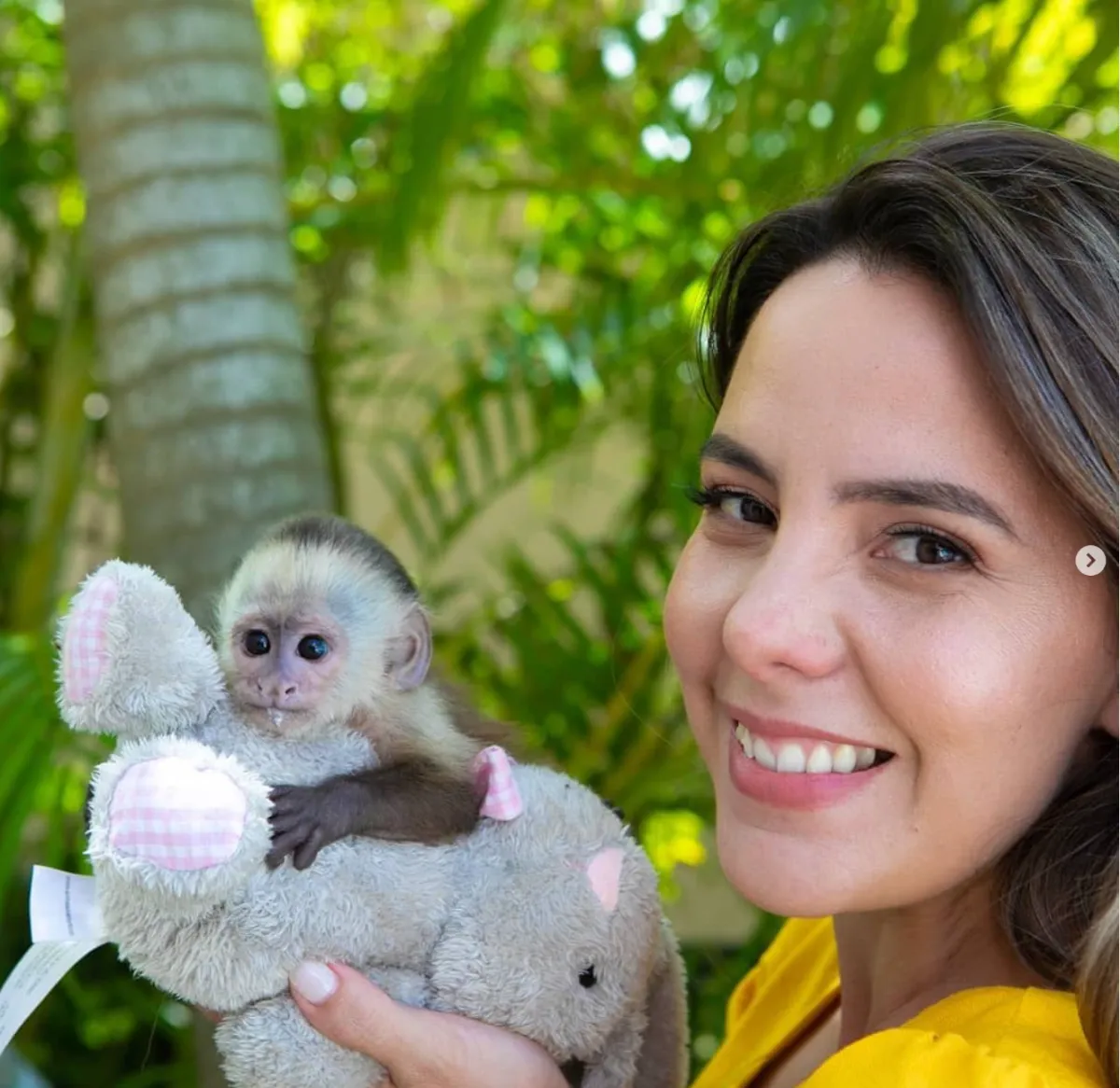 female model with small monkey