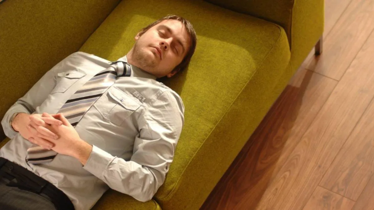 A man taking a power nap.