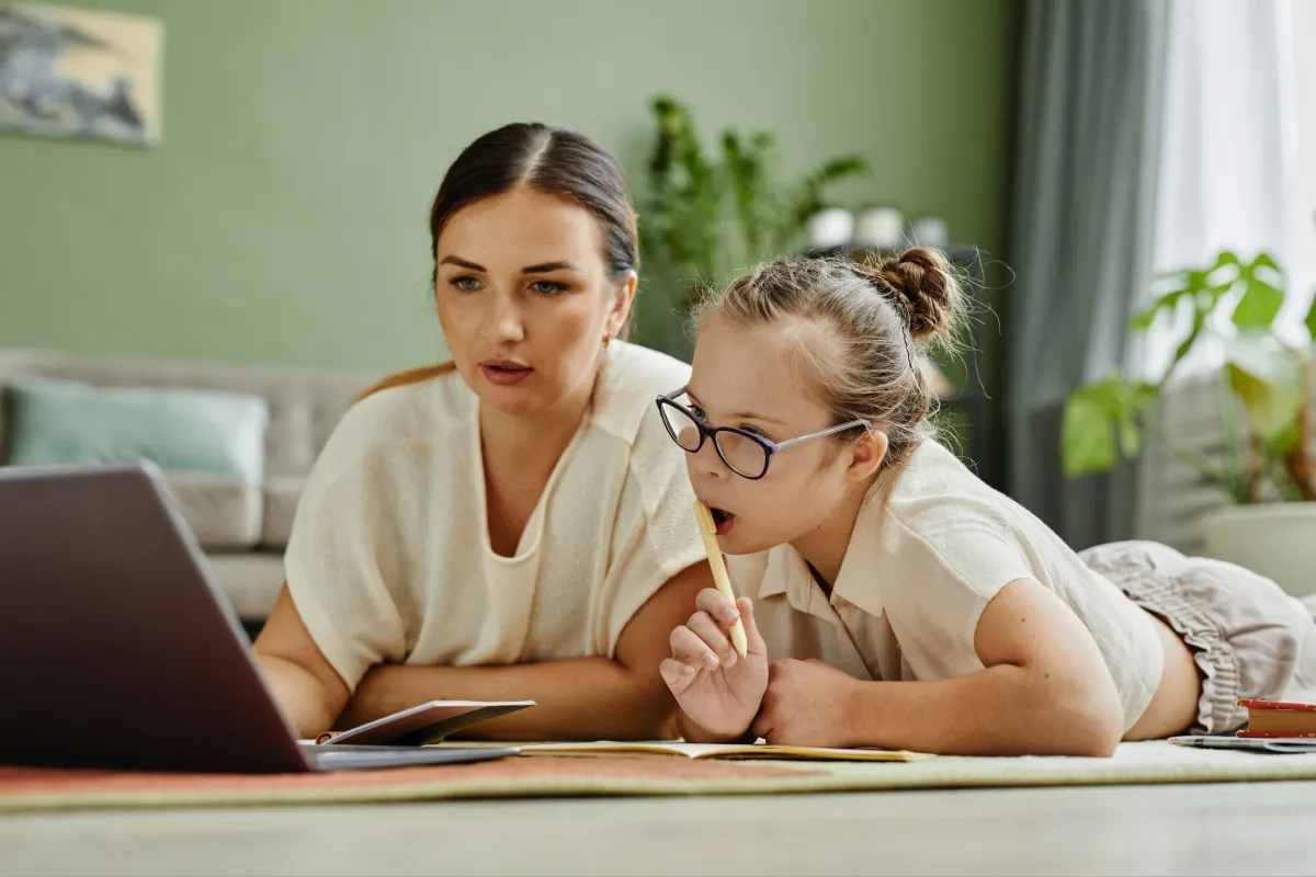 A mother and daughter working on their online middle school homeschool program