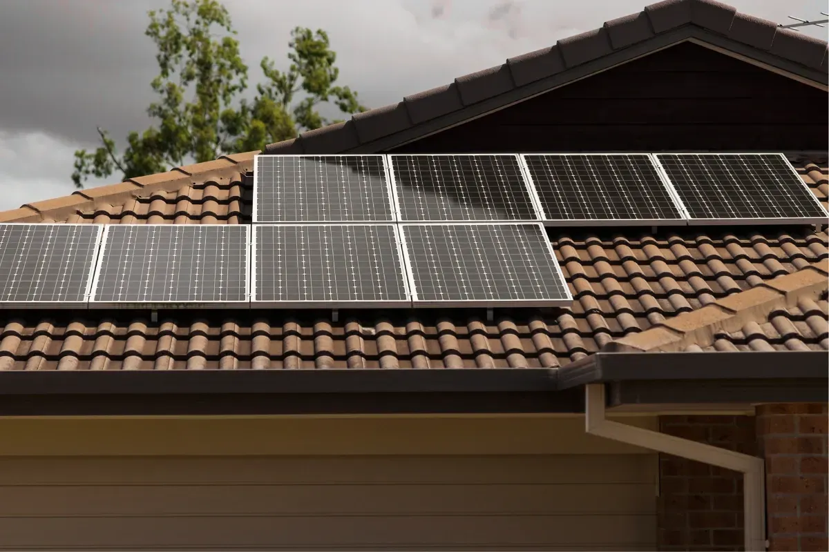 A solar panel half covered by shade