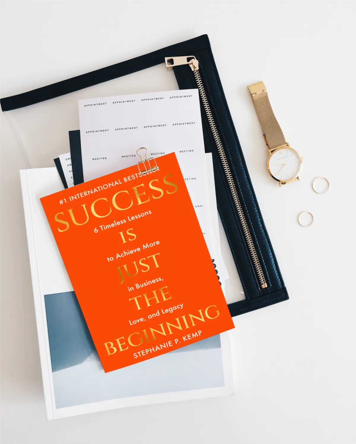 The book Success is Just the Beginning next to the words Expectations Set the Tone for Excellence