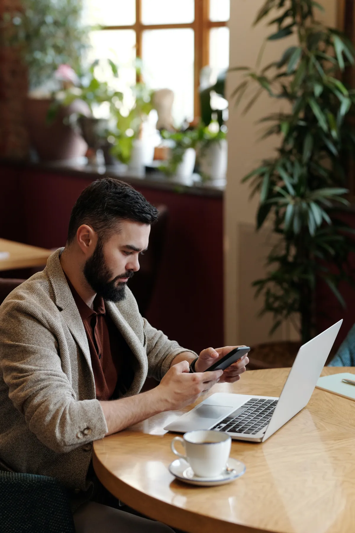 A man looking and wokring on his laptop