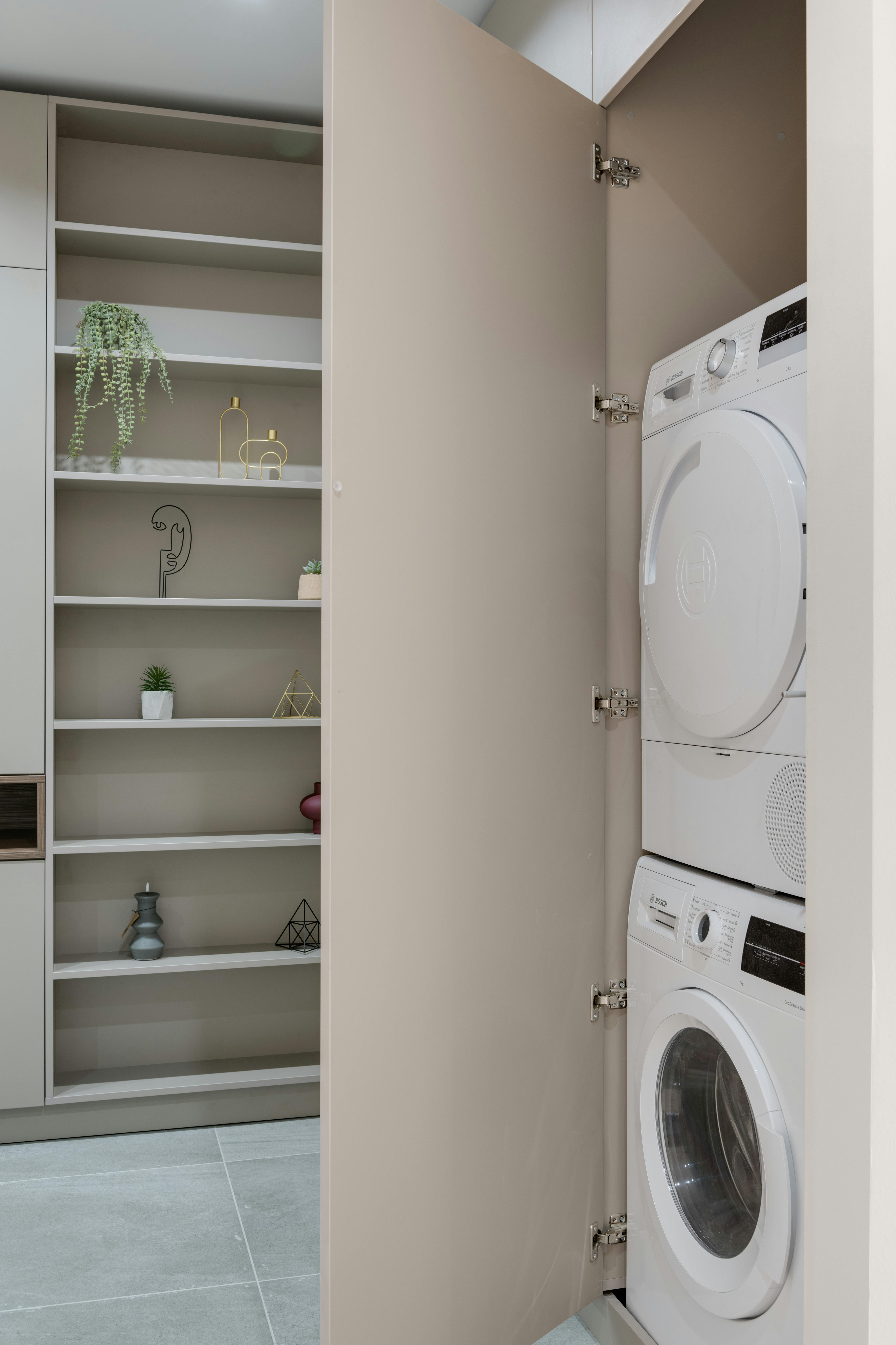 laundry room with cabinets open