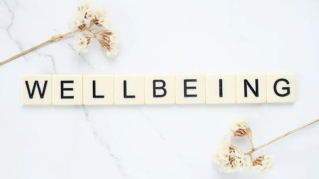 Wellbeing sign with flowers