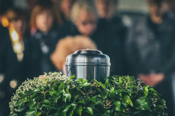 people in the background are looking at an urn