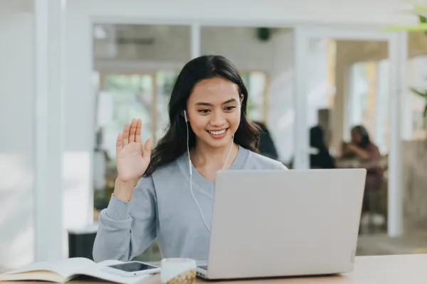 smiling person using laptop at home - stock videos & royalty-free footage