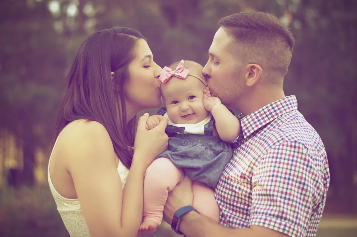 couple holding a baby