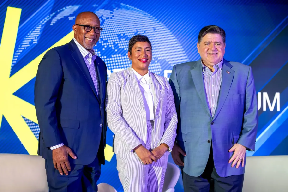 Ambassador Ron Kirk, Ashley Etienne, and Illinois Governor JB Pritzker pose for photographs after a panel discussion during the Global Black Economic Forum’s Business Summit at the 2025 ESSENCE Festival of Culture on Thursday, July 3, 2025 in New Orleans, Louisiana. (Photo: Itoro N. Umontuen/The Atlanta Voice)