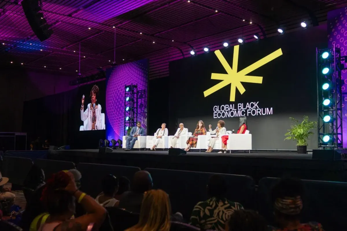 A panel speaks on the Global Black Economic Forum stage during the 2024 Essence Festival of Culture. Photo by Matthew Perschall / The Times-Picayune