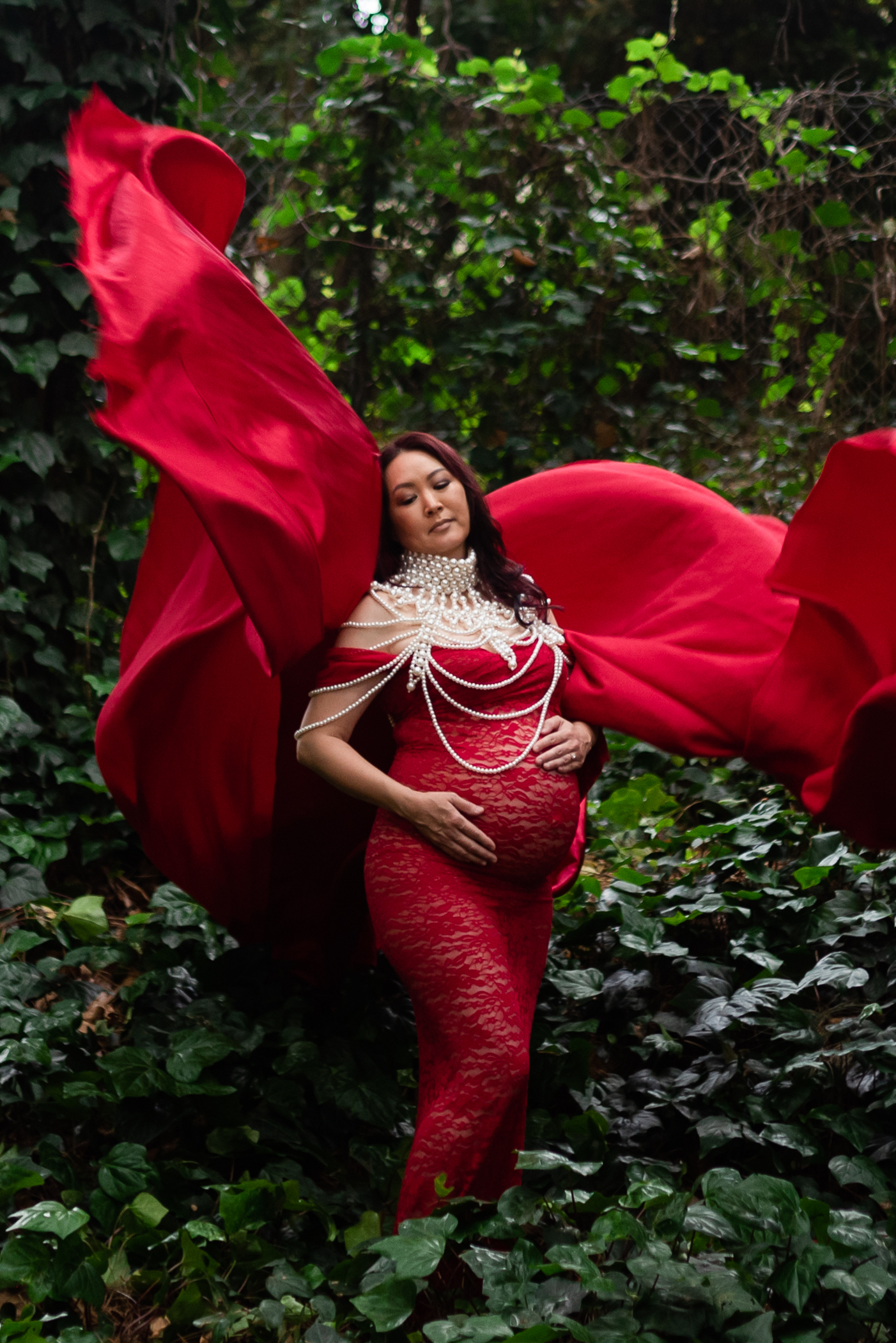 red flying dress with tossing fabric maternity in greenery