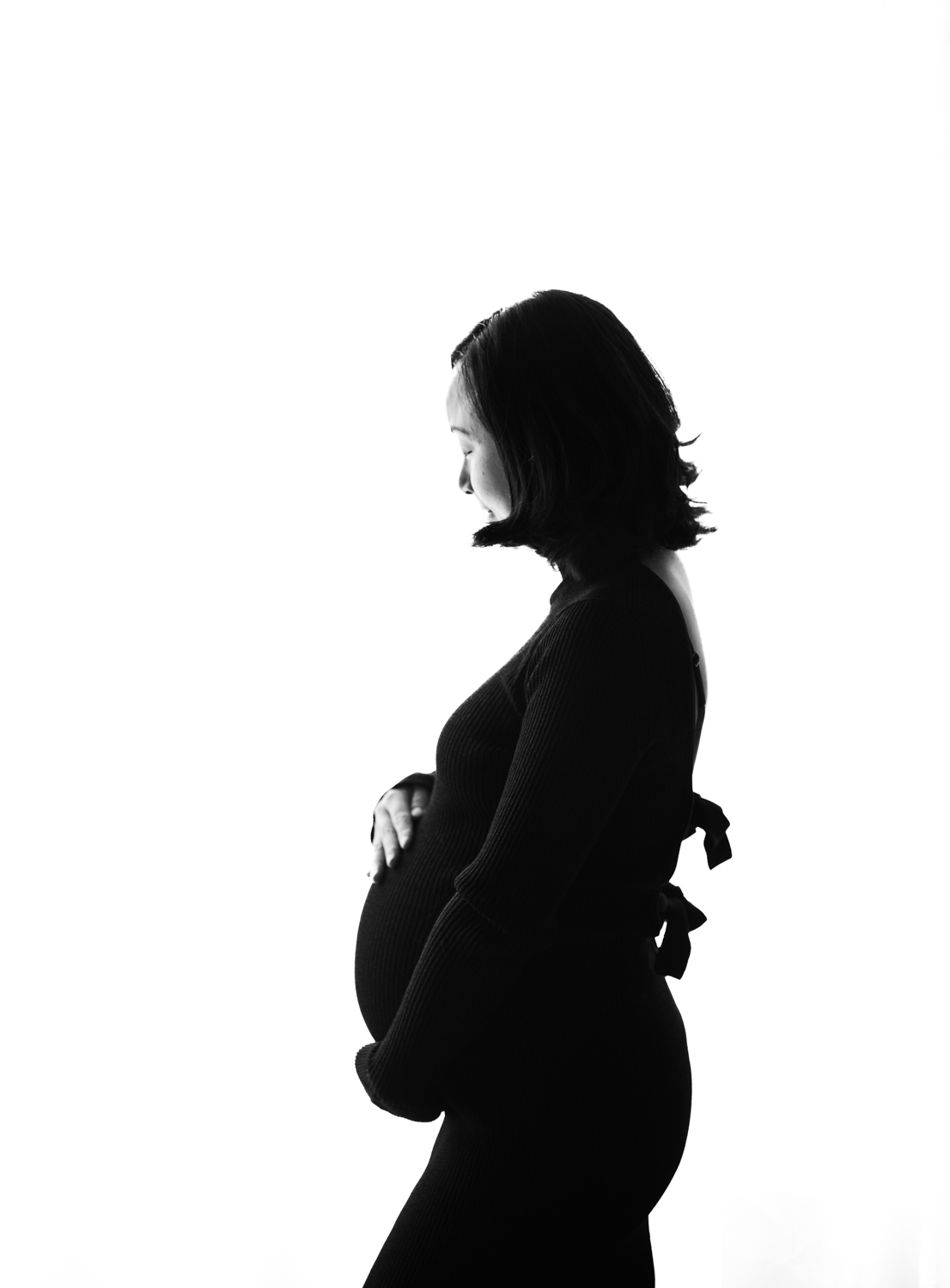 Black and white maternity in black dress