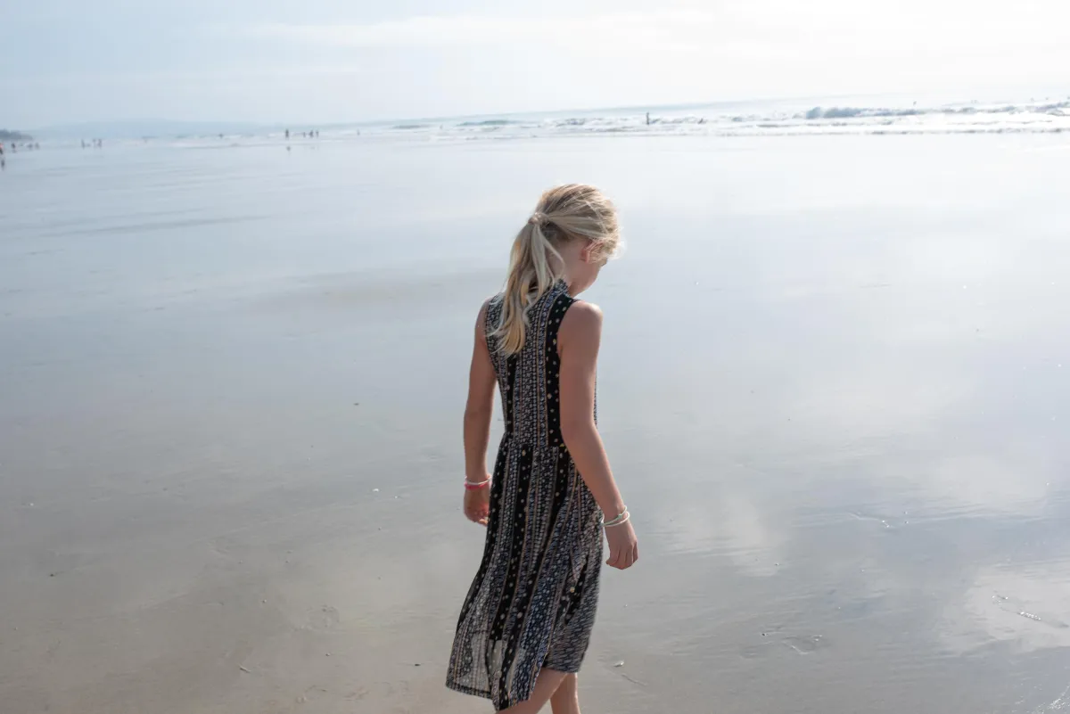 girl standing on the beach
