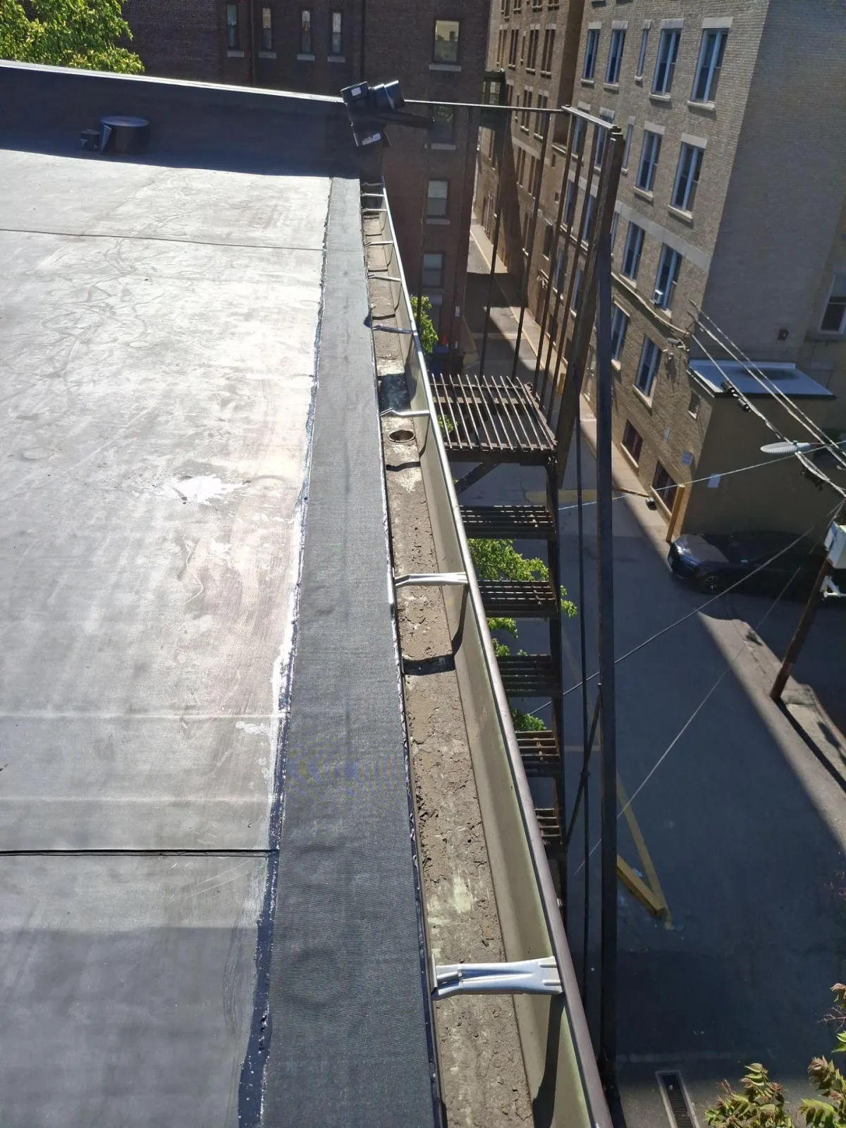 Why do commercial buildings have flat roofs?