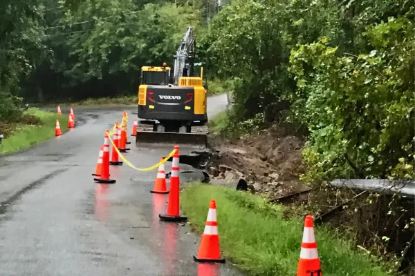 Image of a damaged road and bridge from heavy stormwater runoff