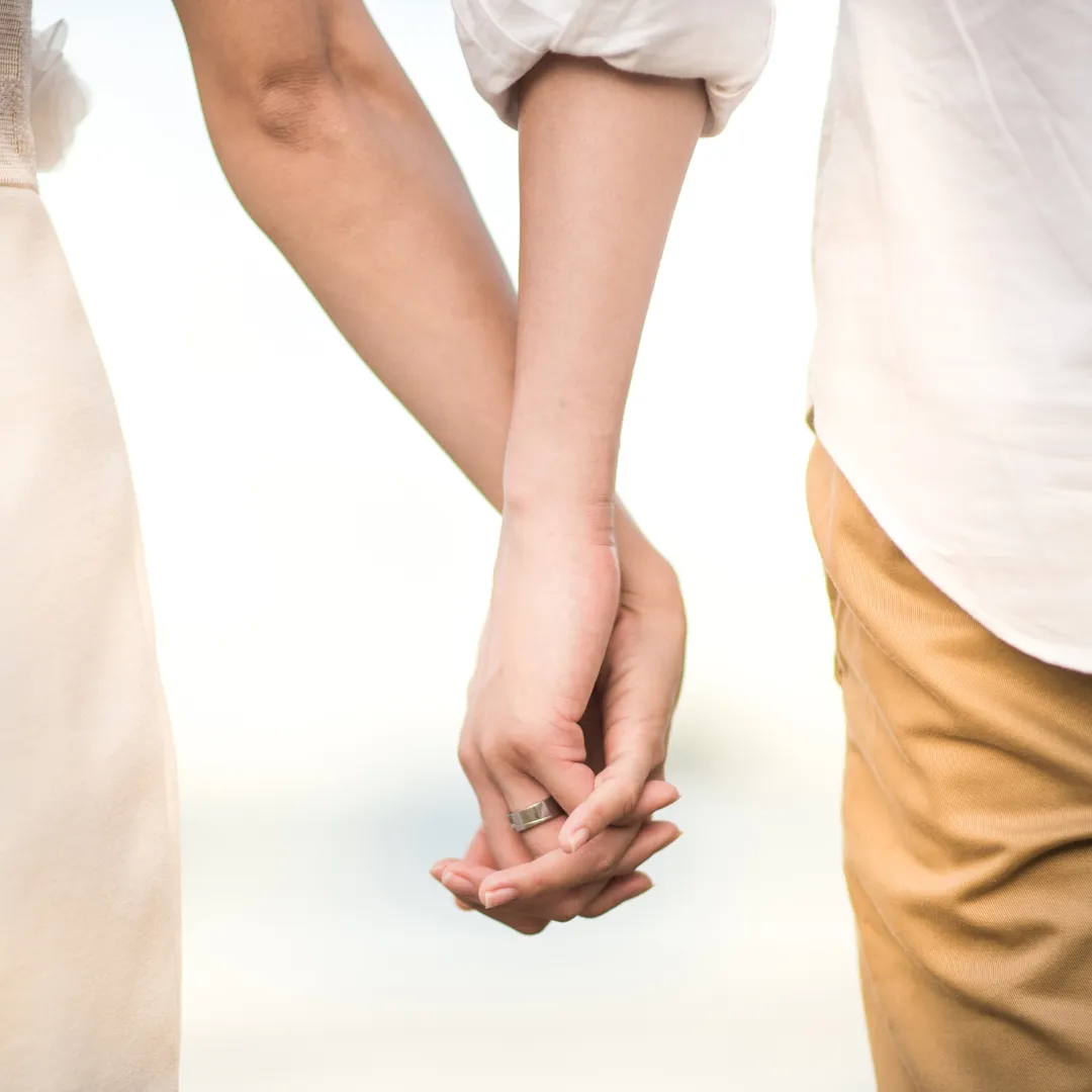 a couple holding hands