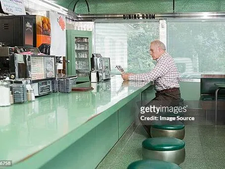 senior man in a diner