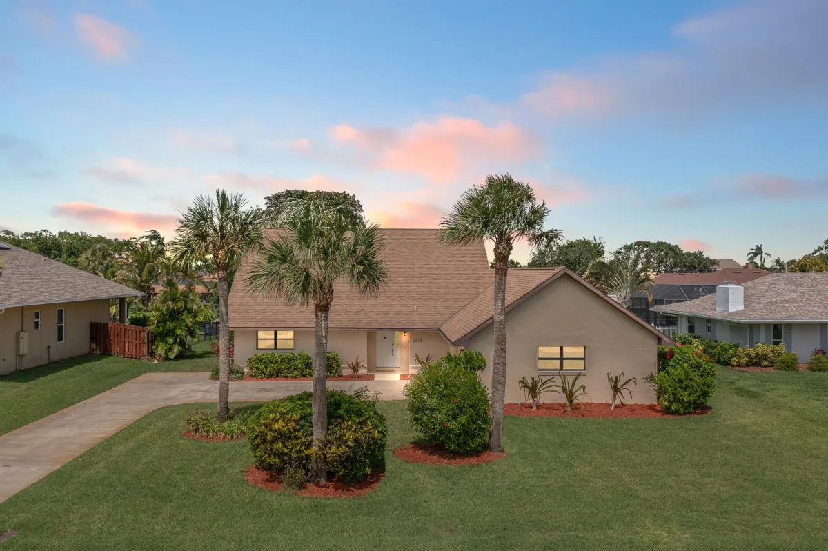 Custom pool and spa overlooking the Banana River with tropical landscaping