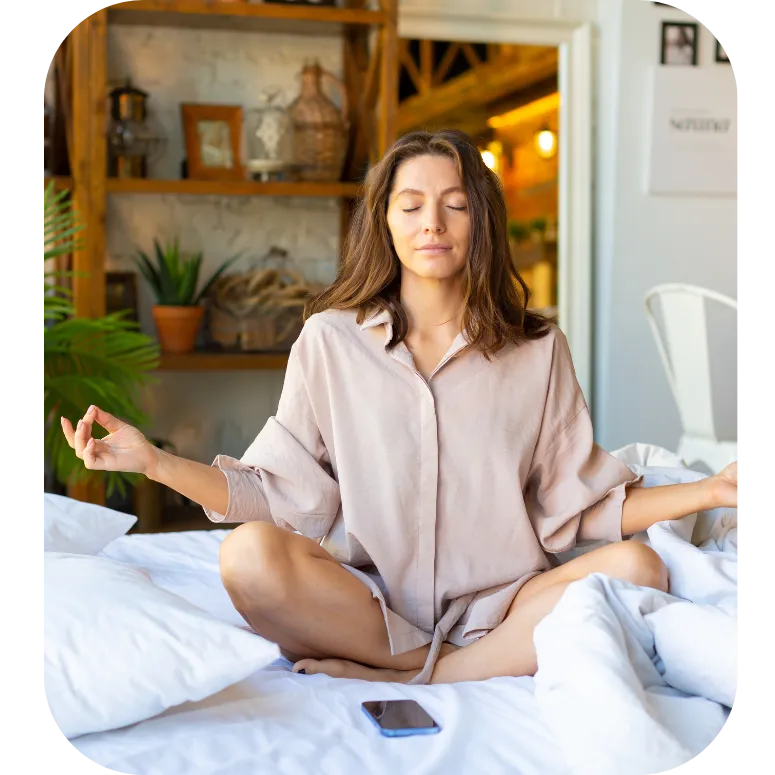 Woman practicing self-healing meditation with hand on heart and belly, releasing emotional weight and reconnecting with inner power.