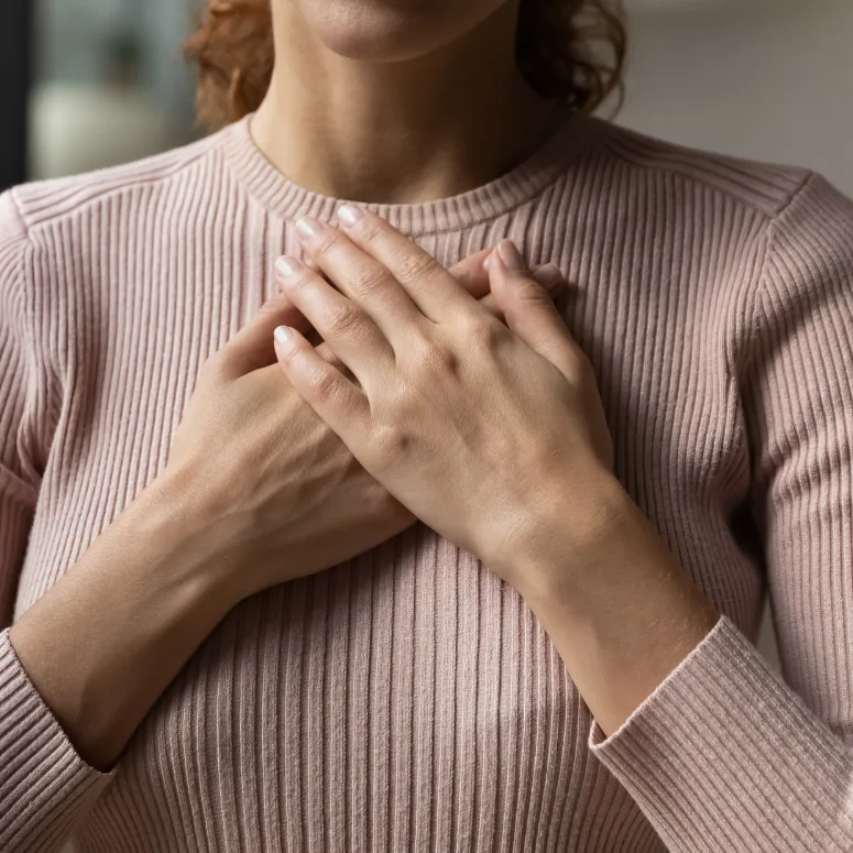 Woman breathing into here body and releasing the tension and pressure