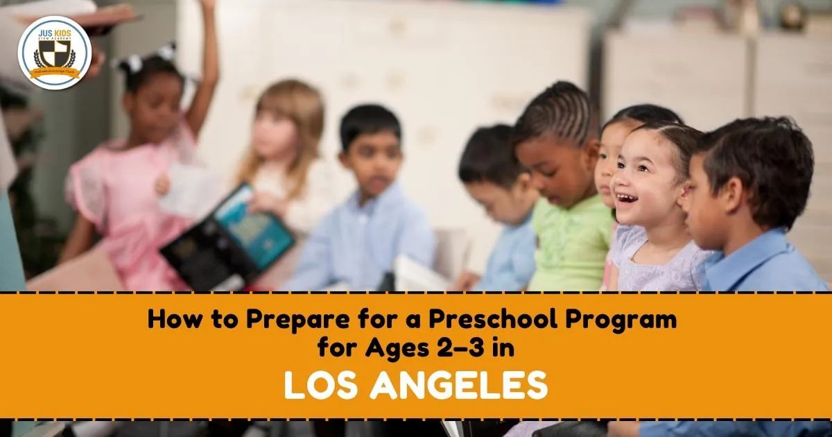 Group of young children in a preschool classroom setting, some holding books and smiling, with text overlay reading ‘How to Prepare for a Preschool Program for Ages 2–3 in Los Angeles’ and the Jus Kids International School logo in the top left corner.