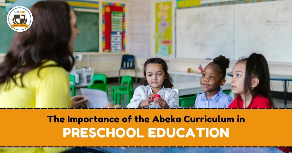 Three preschool children sitting in a classroom listening attentively to a teacher holding a paper, with colorful decorations and a whiteboard in the background. Text overlay reads ‘The Importance of the Abeka Curriculum in Preschool Education’ and the Jus Kids International School logo is in the top left corner.