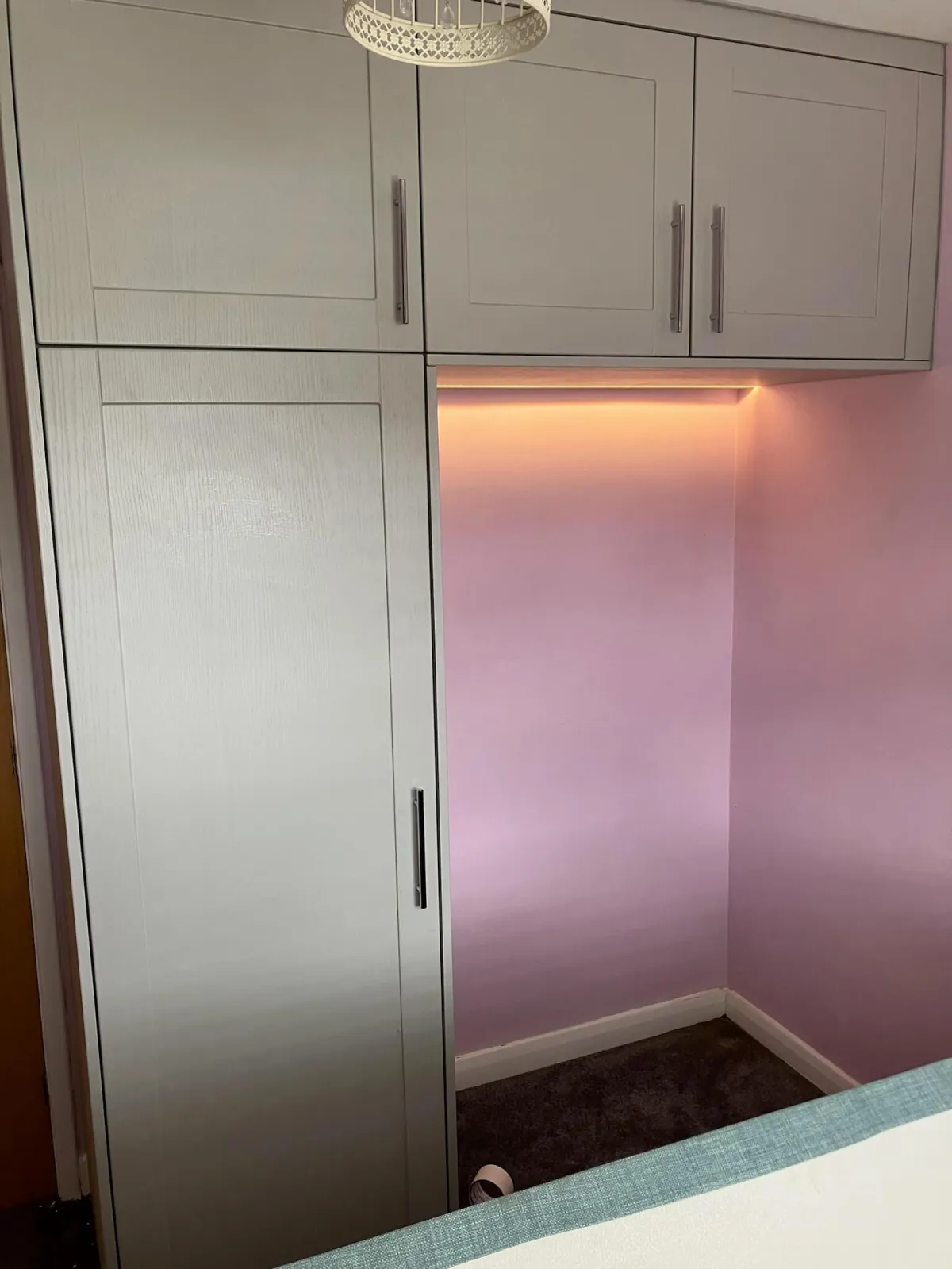 Over bed space saving wardrobe