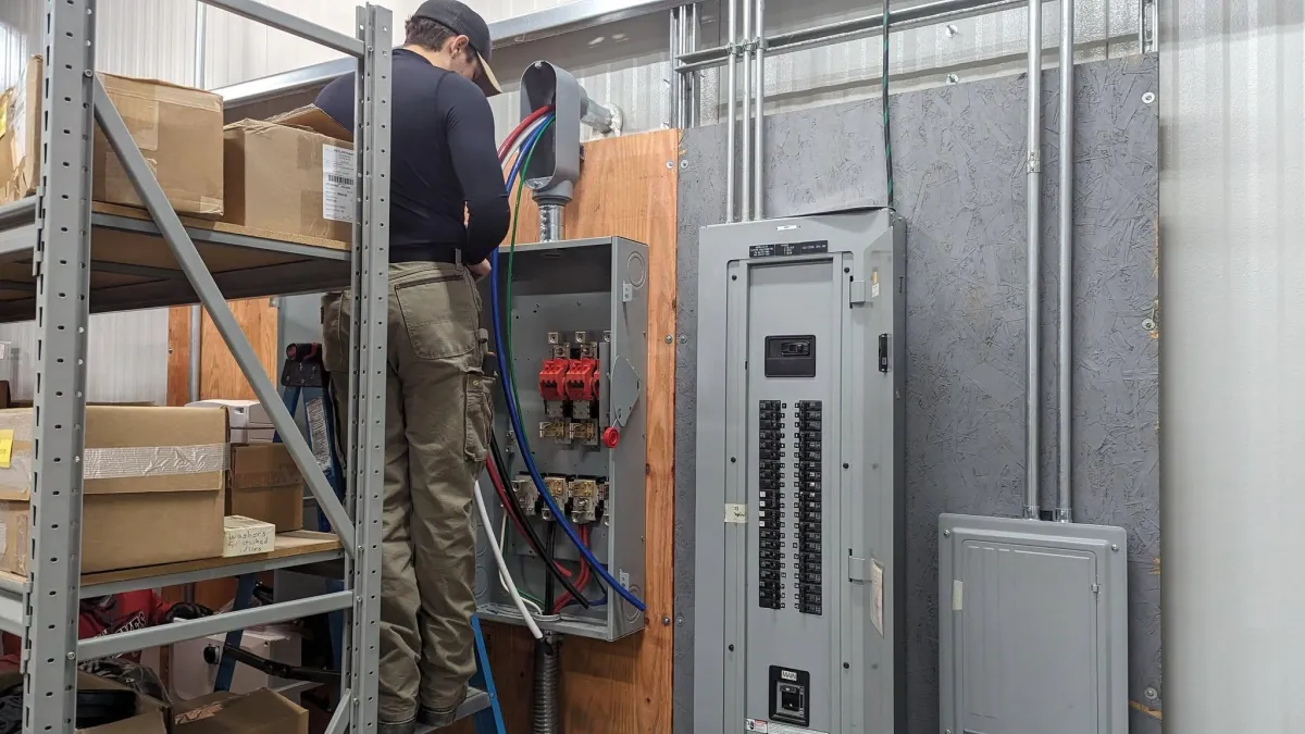 BC Solar - technician installing battery back up and solar