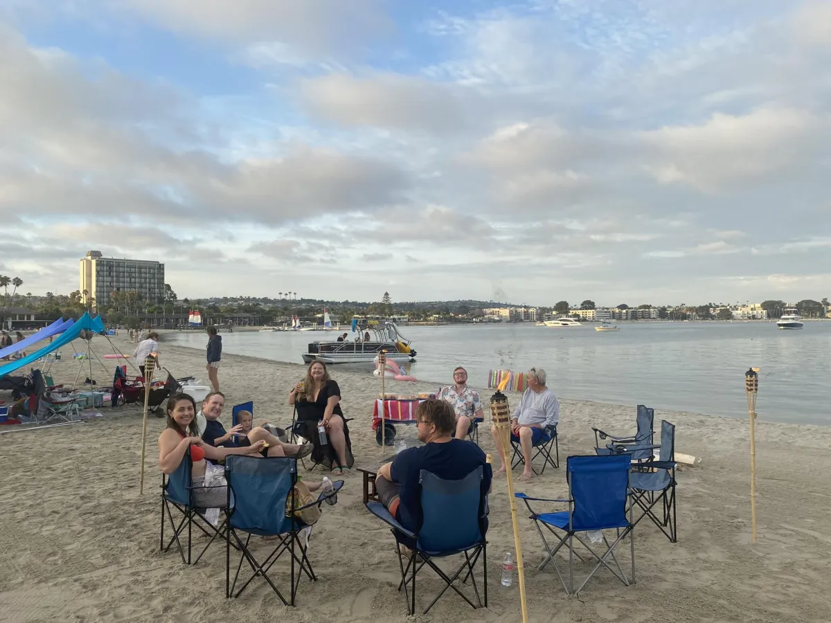 Mission Beach family bonfire rental with seating and tiki torches.