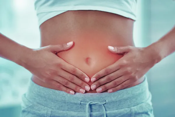 gut inflammation, hands over gut