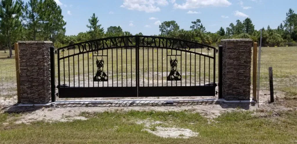 Dog themed ranch style driveway gate installed