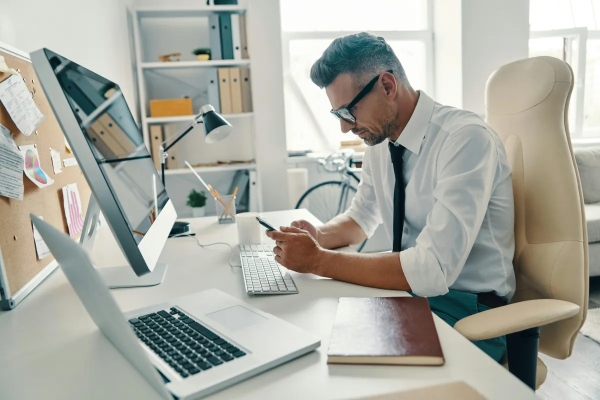 Marketing agency owner reviewing monthly financials on laptop