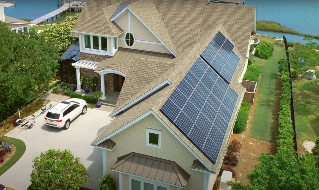 House with solar panels on roof, renewable energy and solar power