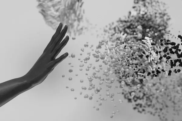 A human hand reaching out to the concept of generative AI