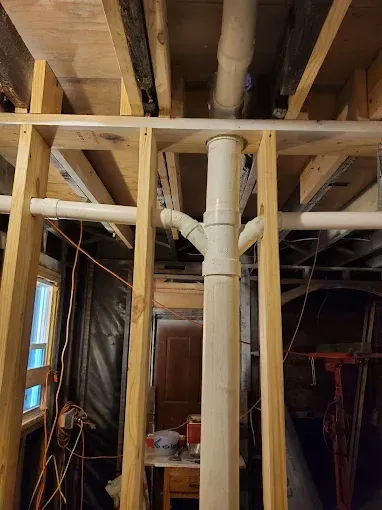 PVC pipe inside of house framing